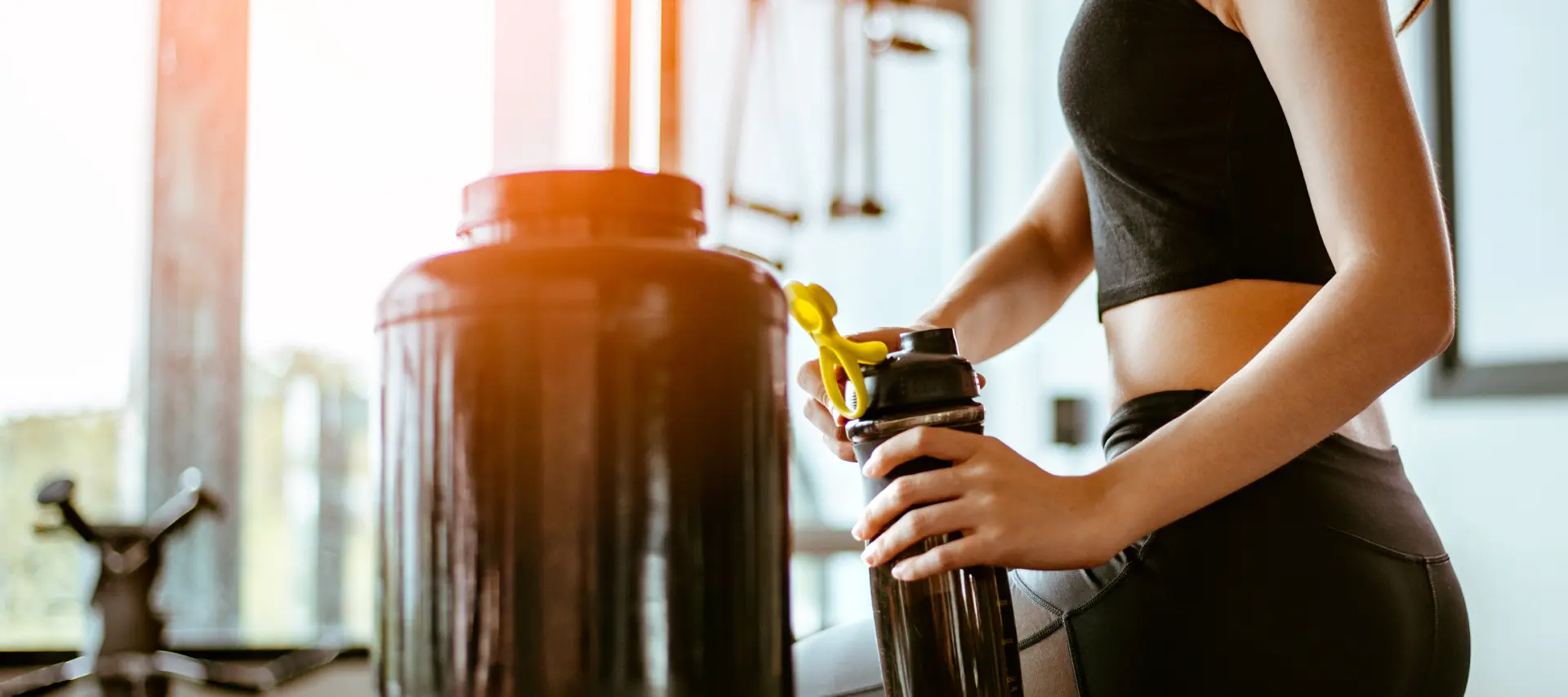 a person holding a protein shake