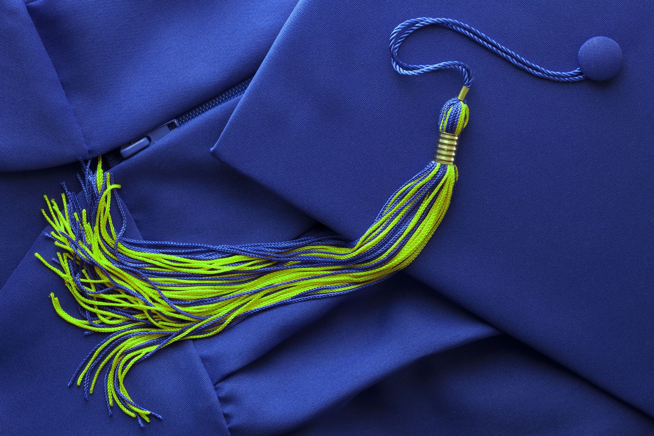 blue graduation cap with blue and green tassel
