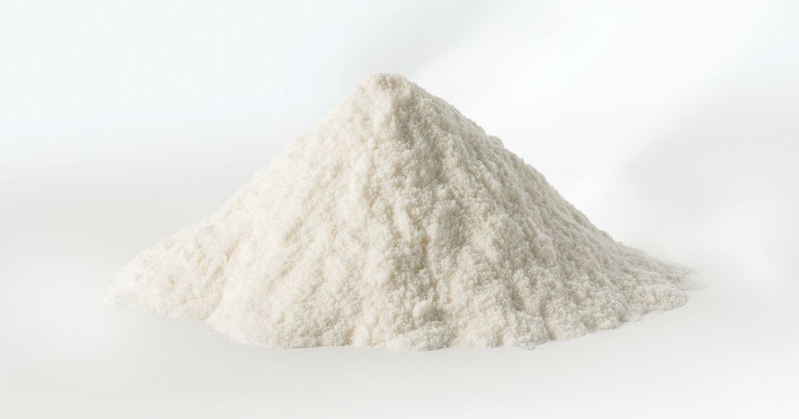 pile of high quality whey protein on a white table