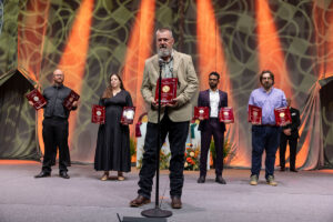 Hilmar employees accept nine awards on stage at the World Championship Cheese Contest Awards Ceremony on behalf of Hilmar
